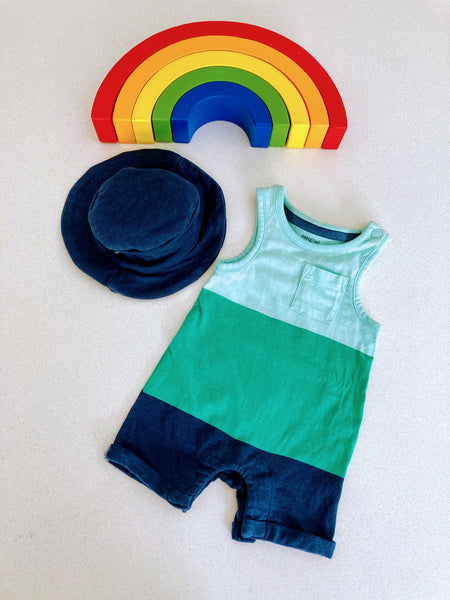 Blue and green playsuit and sun hat